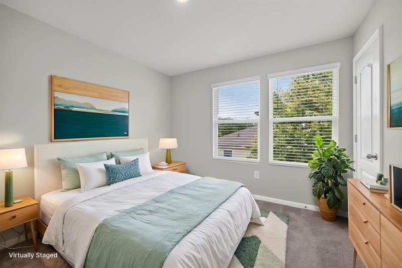 Bedroom virtually staged with bed and plant at 2837 Black Buck Cir, Jacksonville, FL 32225