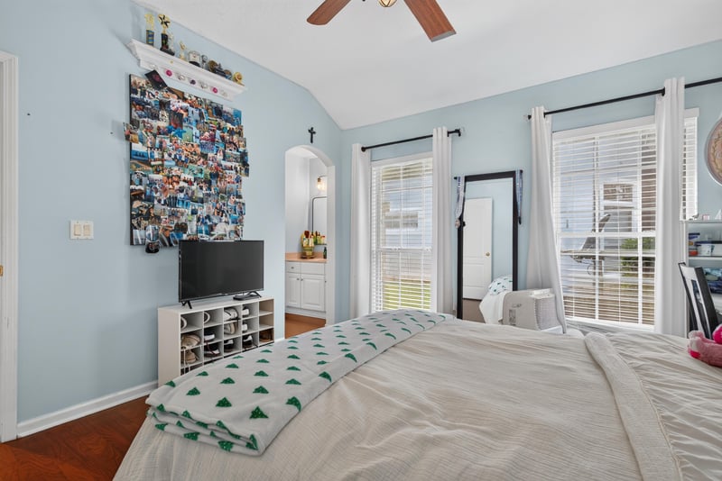 Bedroom with TV and French doors at 2304 Spring Hill Ct, Orange Park, FL