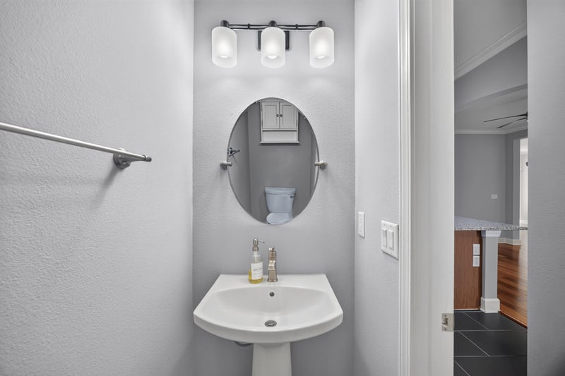 Half bathroom with pedestal sink at 6217 Eclipse Cir, Jacksonville, FL 32258