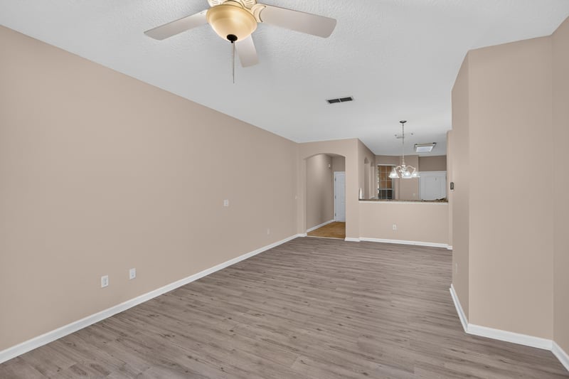 Living room with wood-look flooring at 3762 Hartsfield Forest Cir, Jacksonville, FL 32277