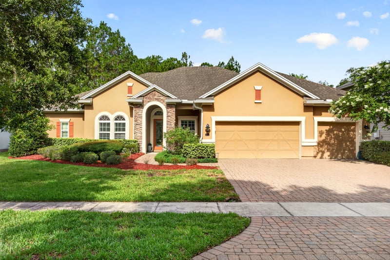 Front exterior with tile roof and arched windows at 276 Cross Ridge Dr, Ponte Vedra Beach, FL 32081