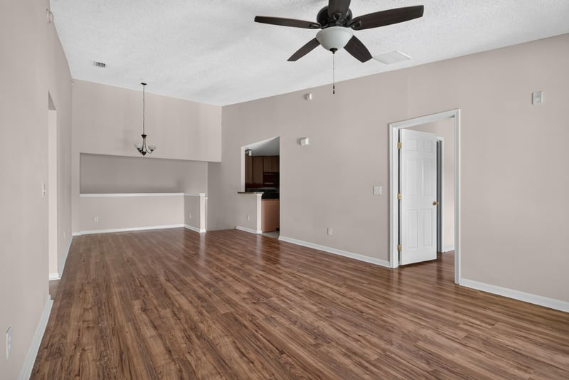 Open living area with wood-look flooring at 7047 Deer Lodge Cir, Jacksonville