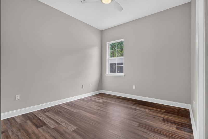 Bedroom with wood floor and window at 4109 Eagle Landing Pkwy, Orange Park, FL 32065