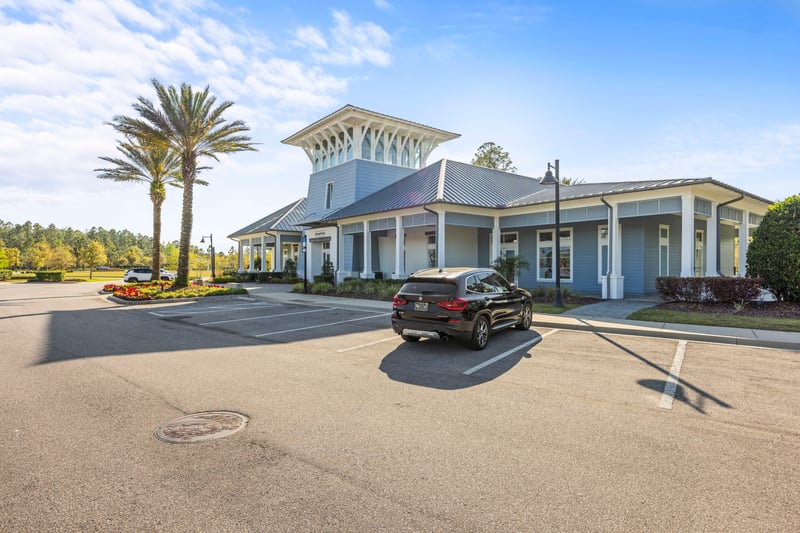 Clubhouse parking lot with palm trees in St. Johns, FL