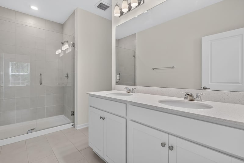 Bathroom with glass shower and double vanity at 39 Mellowood Ln, St. Augustine, FL 32092