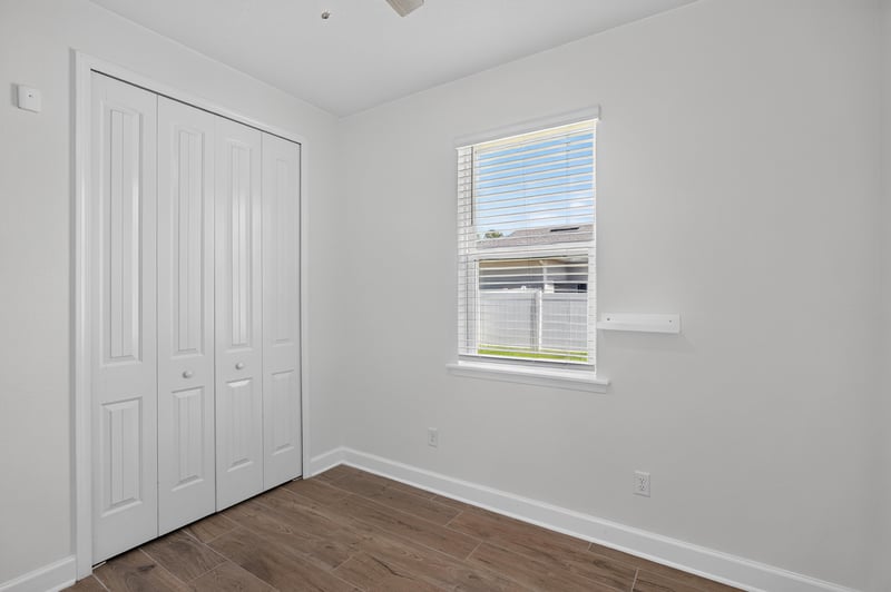 Bedroom with closet and window at 855 Flach Dr, St. Johns, FL