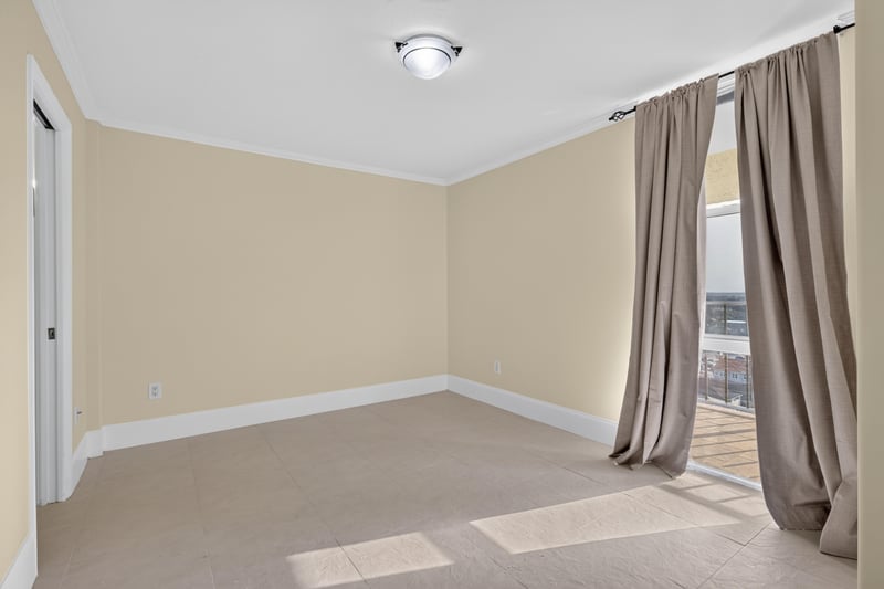 Bedroom corner with window and curtain at 1301 1st St S