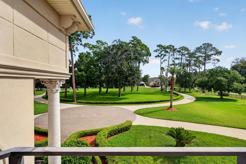 Covered porch view of the grounds and walking path at 344 Broward Rd, Jacksonville, FL