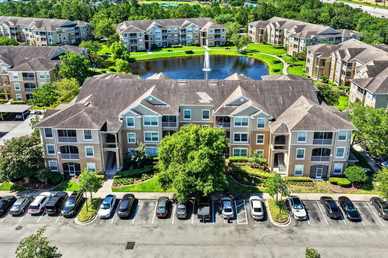 Aerial view of condo community with ponds and buildings in Jacksonville