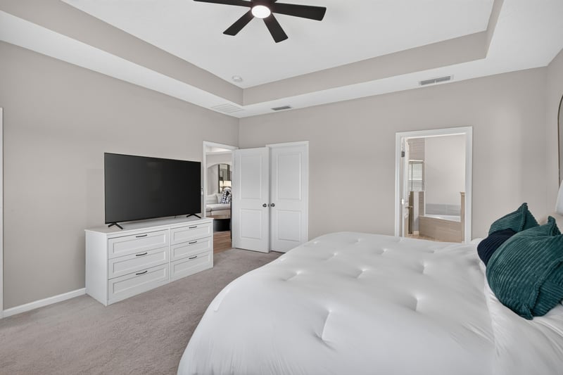 Primary bedroom with second entry door at 9942 Lovage Ln, Jacksonville, FL 32219