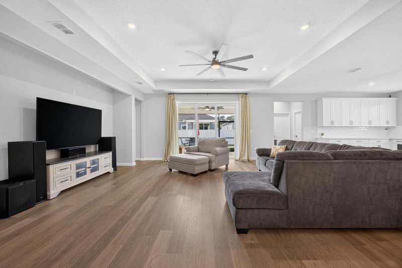 Living room with ceiling fan and sliding glass doors at 2354 Jennings Farm Dr, Middleburg, FL 32068