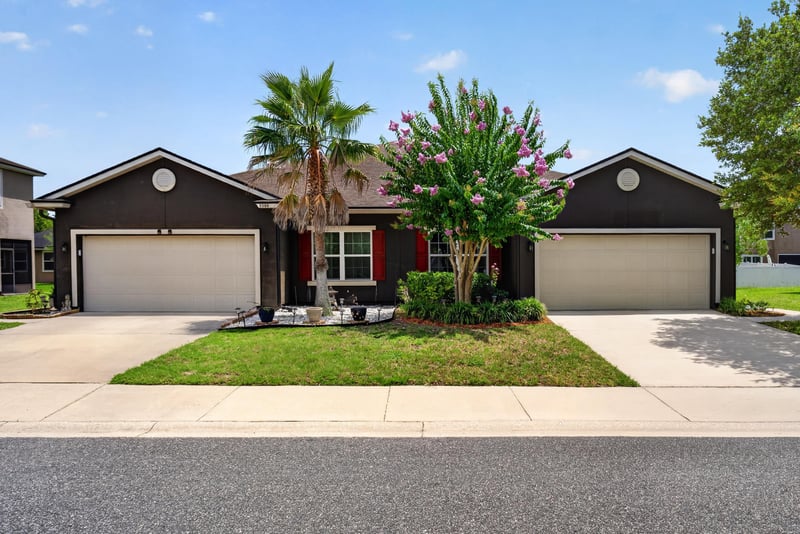 Front exterior in daylight with attached garage and landscaping at 2378 Caney Oaks Dr, Jacksonville, FL