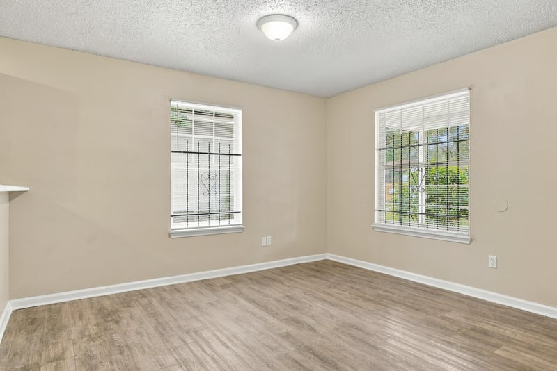 Empty dining room with two windows at 219 Shortreed St, Jacksonville, FL 32254