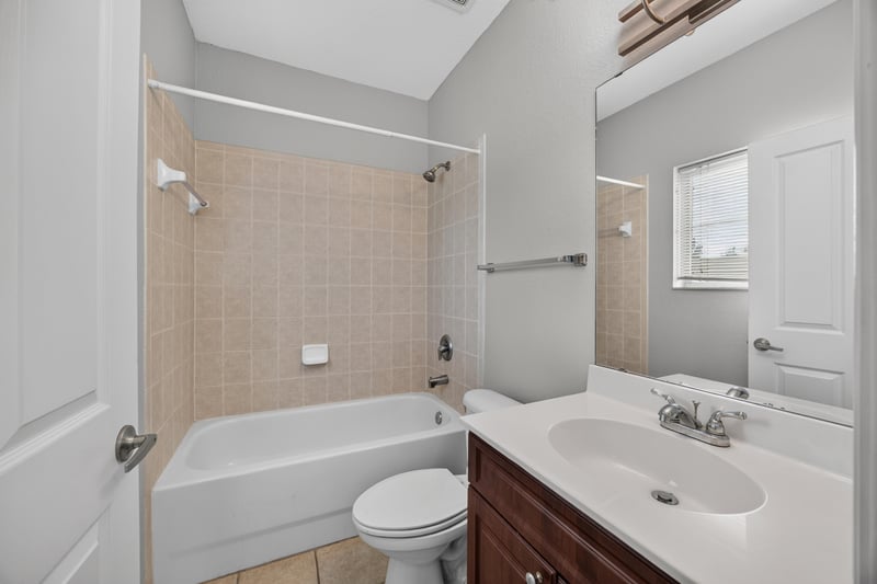 Bathroom with tiled tub-shower combo at 9745 Touchton Rd, Jacksonville, FL 32246
