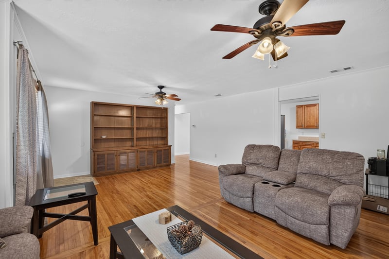 Living room with built-in shelving and sofa at 1847 Grove Park Dr, Orange Park, FL