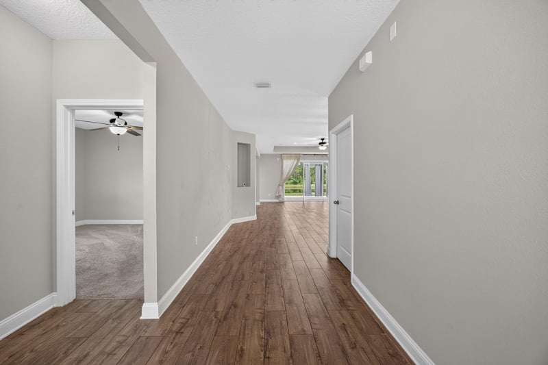 Entry hallway with wood flooring leading to open living space at 53 Lumen Ct, St. Augustine, FL 32095