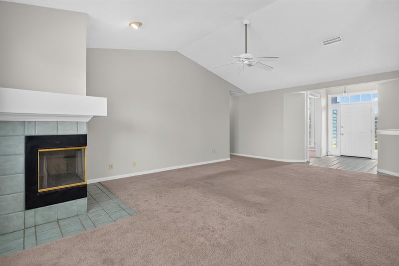 Living room with fireplace and vaulted ceiling at 400 Ashcroft Landing Dr, Jacksonville, FL 32225