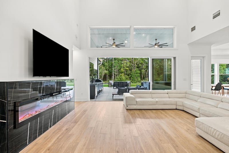 Great room with fireplace and sectional sofa at 907 Seagrove Dr, Ponte Vedra Beach, FL 32081
