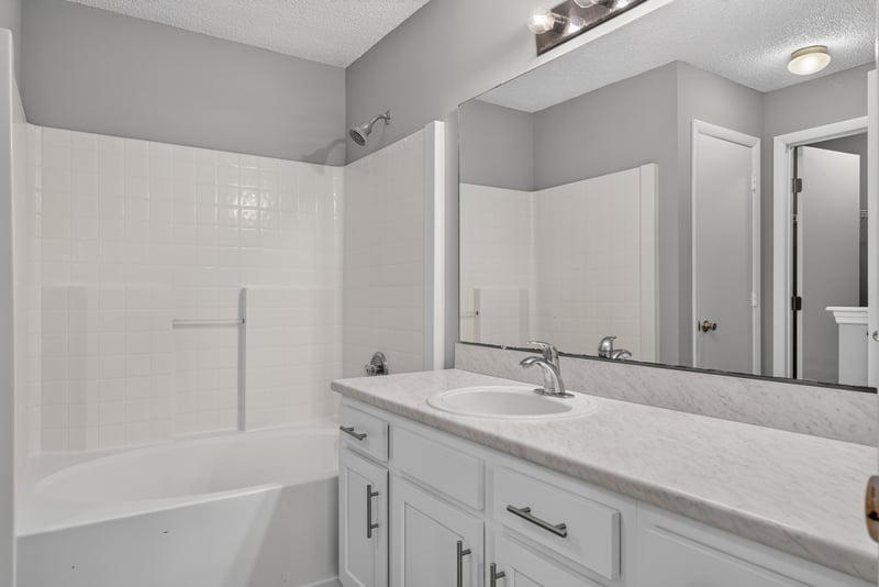 Bathroom with tub-shower combo and white vanity at 1108 Hidden Cove Cir S, Atlantic Beach, FL 32233