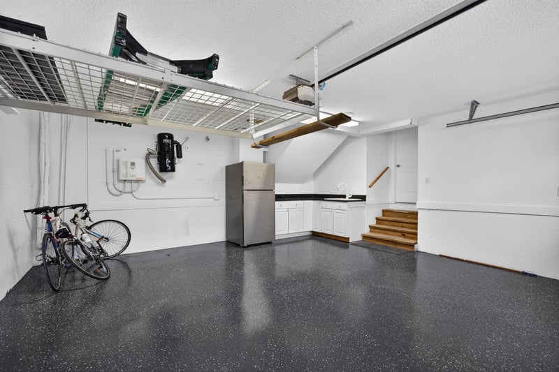 Garage with stairs to main level at 117 Island Cottage Way, St. Augustine, FL 32080