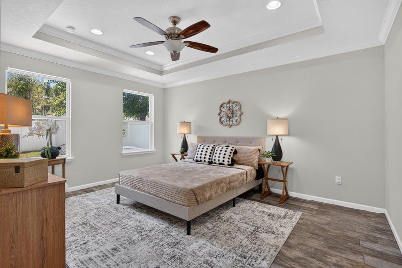 Primary bedroom with tray ceiling and ceiling fan at 10066 Andean Fox Dr, Jacksonville, FL 32222