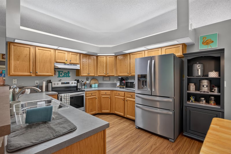 Kitchen with counters and stainless refrigerator at 13514 Las Brisas Way N, Jacksonville, FL
