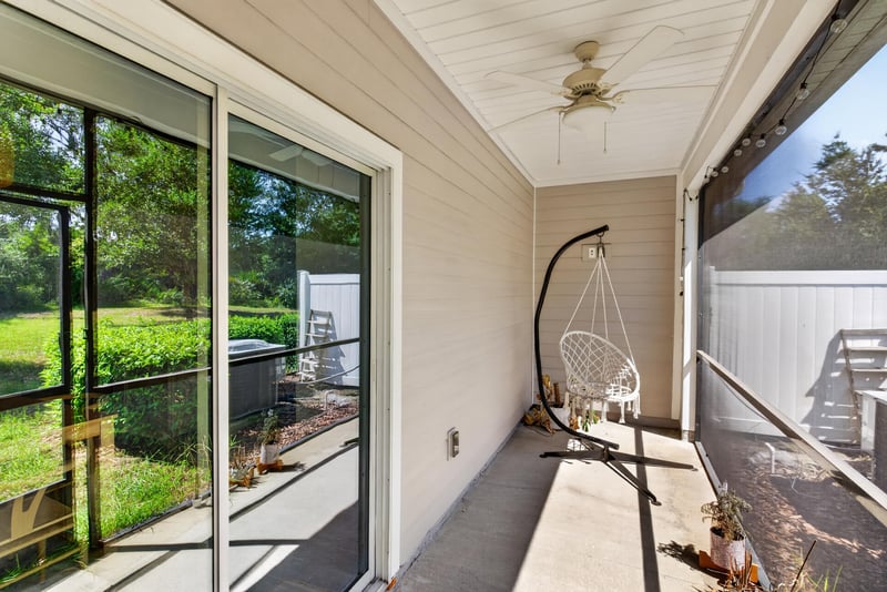 Screened porch with sliding glass doors at 1186 Beach Dune Dr, Jacksonville, FL 32233