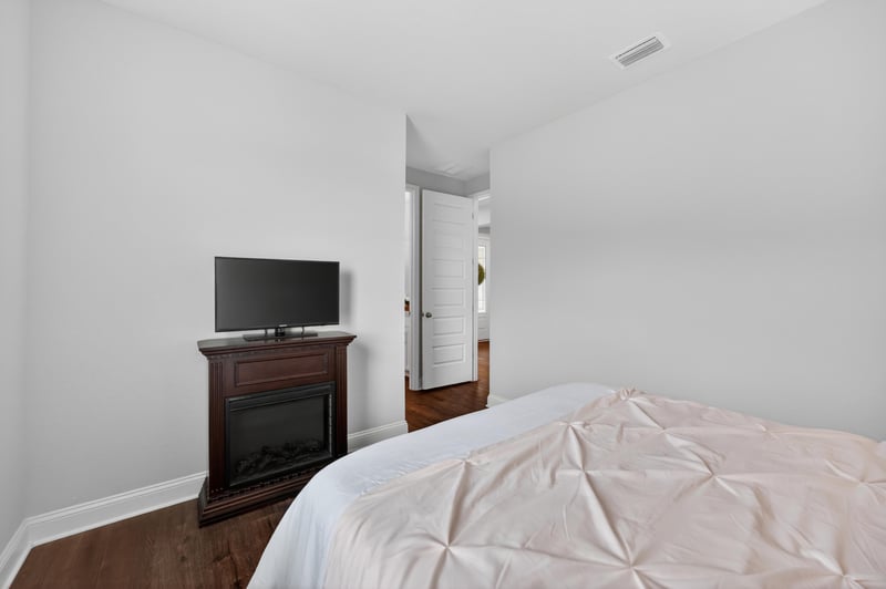Bedroom with wall mounted TV at 85491 Fall River Pkwy, Fernandina Beach, FL 32034