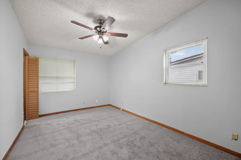 Carpeted bedroom with window at 11462 Elane Dr, Jacksonville, FL