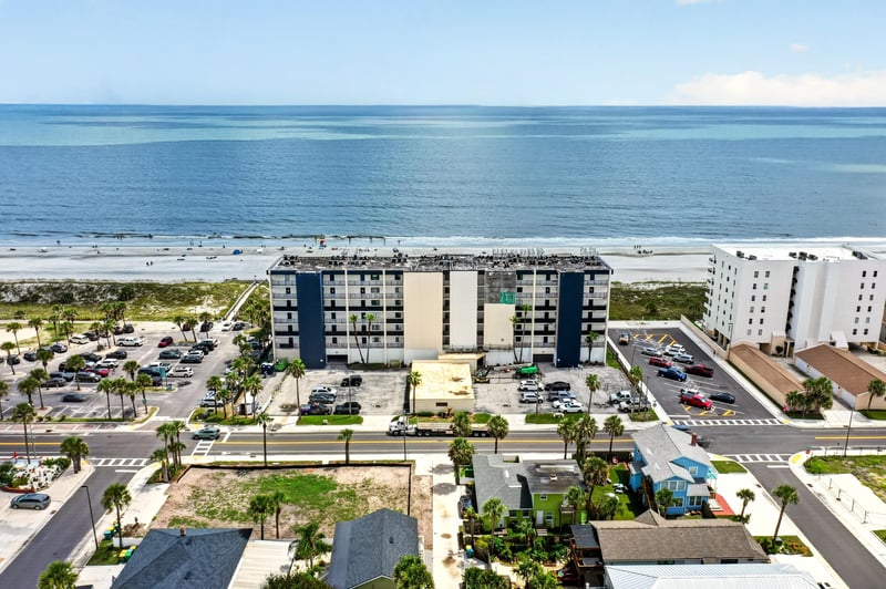 Aerial ocean view with the building at 601 1st St S, Jacksonville Beach