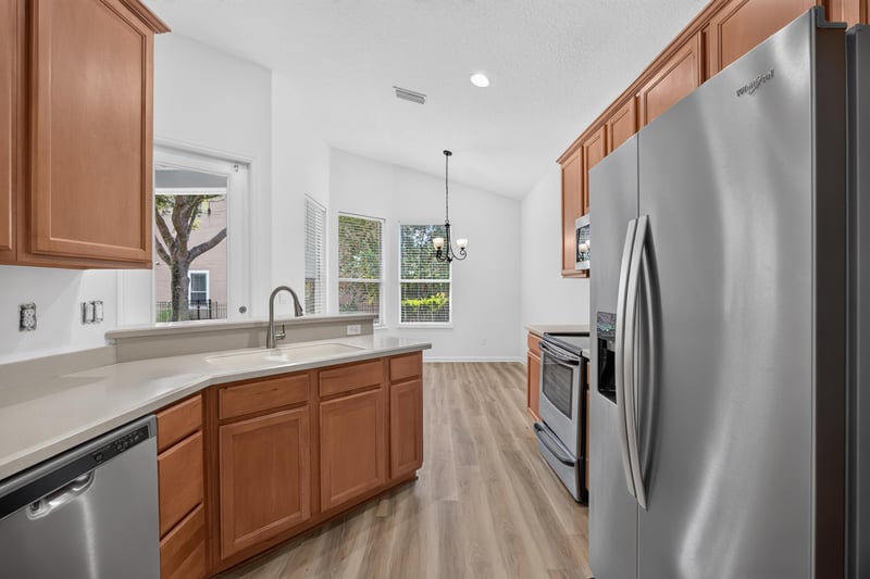 Kitchen island with pendant light and window at 3101 E Banister Rd, St. Augustine, FL 32092