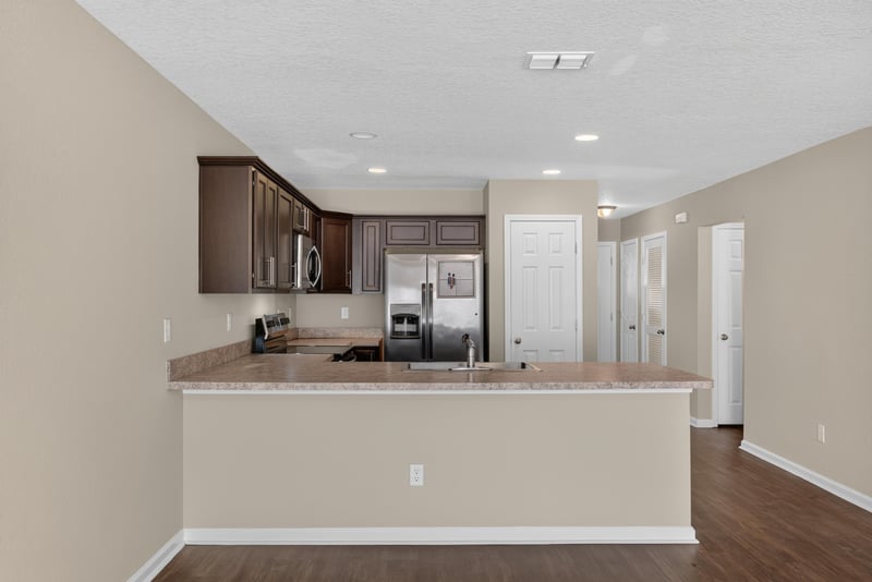 Kitchen with dark cabinets and stainless appliances at 7253 Townsend Village Ct, Jacksonville, FL