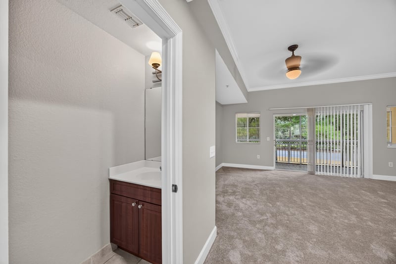 Powder bath with cherry vanity cabinet at 9745 Touchton Rd, Jacksonville, FL 32246