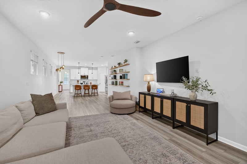 Living room with console table and TV at 93 Lochloosa Ct, St. Johns, FL 32259
