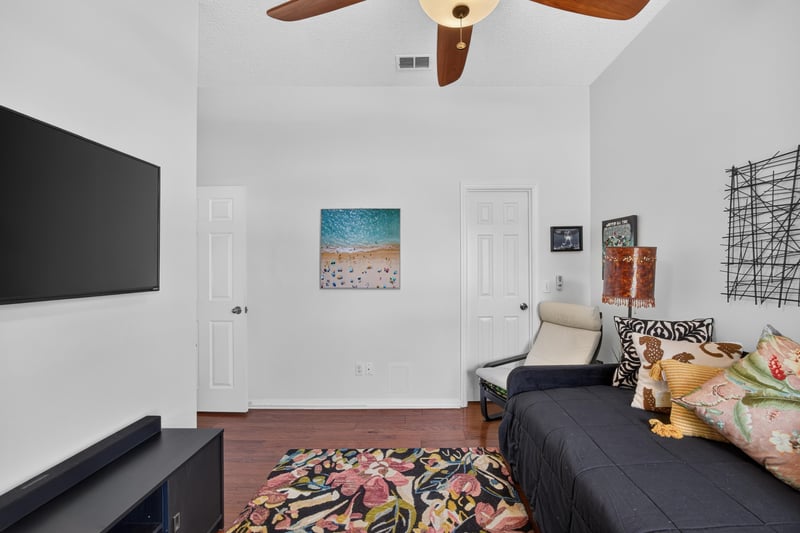 Sitting room with wall-mounted television at 1820 Burgess Hill Dr E, Jacksonville, FL