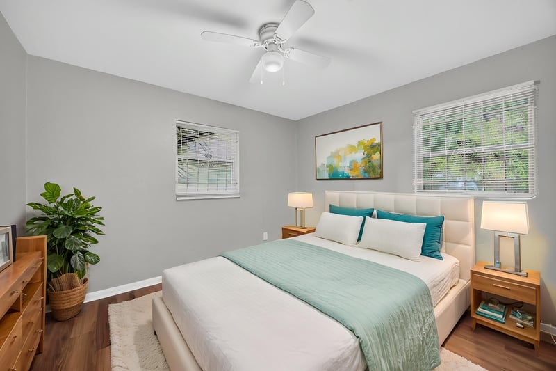 Virtually staged bedroom with bed and nightstands at 4030 Leonard Cir W, Jacksonville, FL 32209