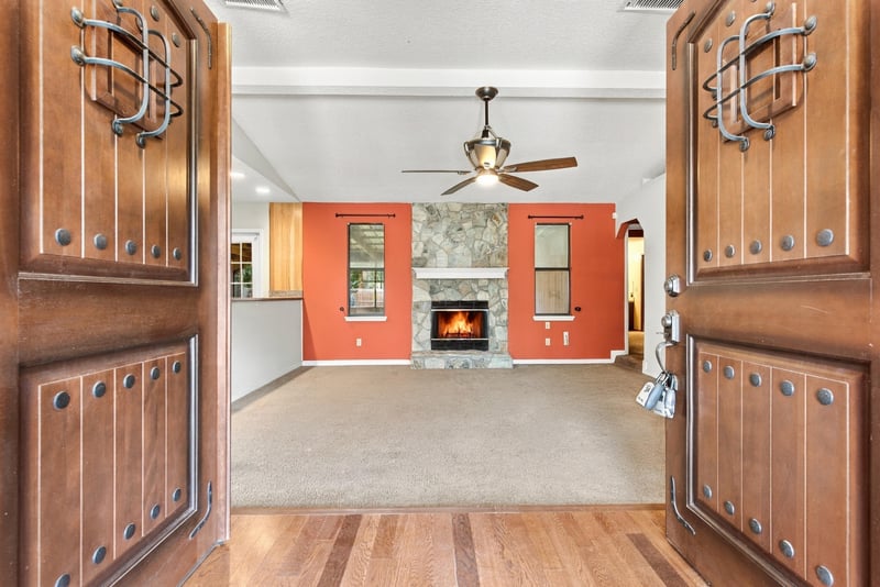 Living room with built-in cabinetry and stone fireplace at 2915 Trenton Ct, Orange Park, FL