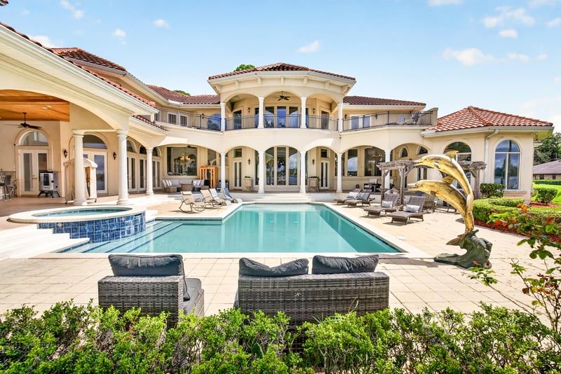 Rear exterior with pool and two-story balconies at 344 Broward Rd, Jacksonville, FL