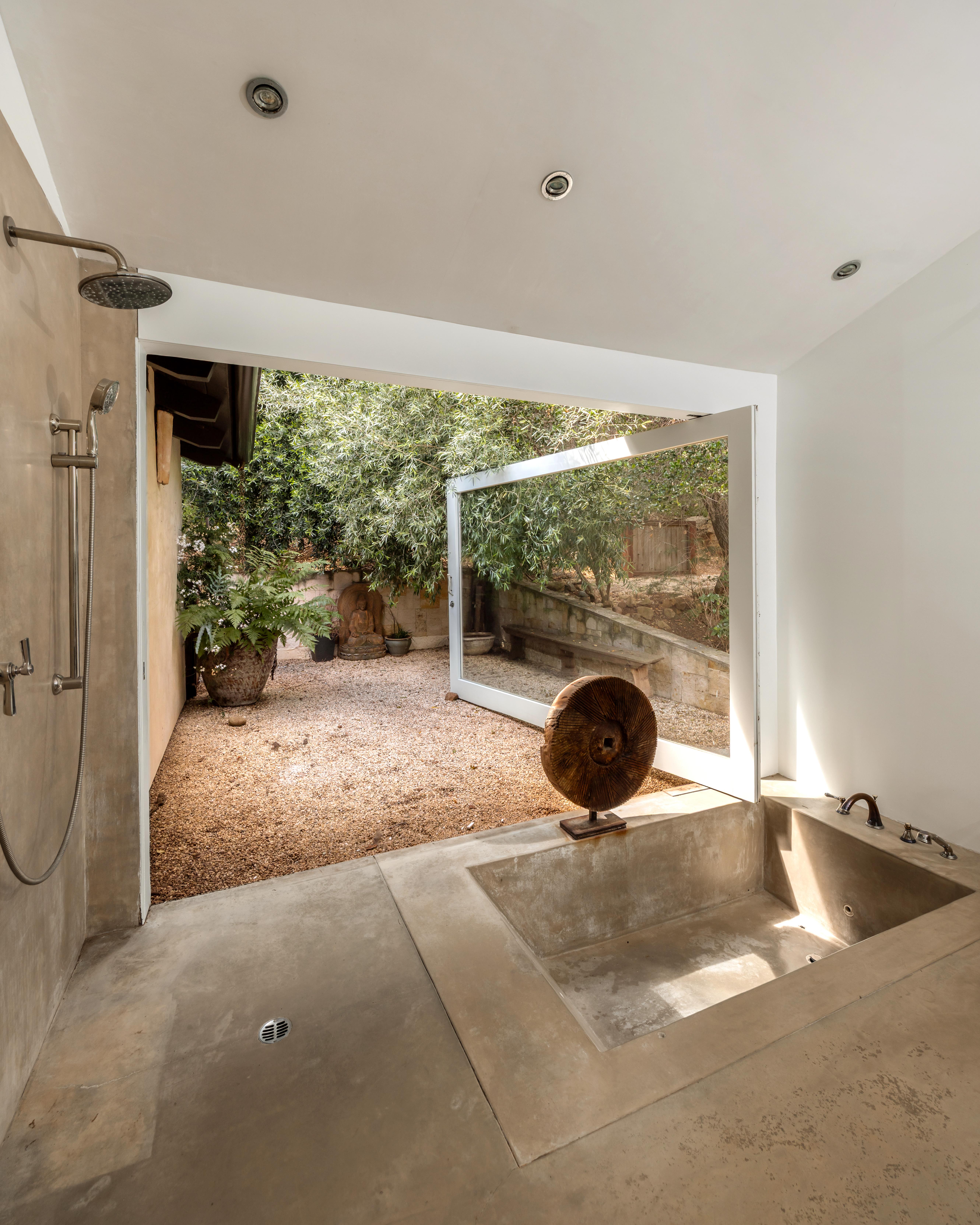 Exterior facade of luxury canyon residence at 647 Old Topanga Canyon Rd, Topanga, CA — professional real estate photography by VirTour Media showcasing the natural integration of architecture and Southern California landscape. Our team captured still photography, a cinematic property video, a lifestyle video, an agent narration, a true vertical social media reel, and an FPV video tour throughout the midday.