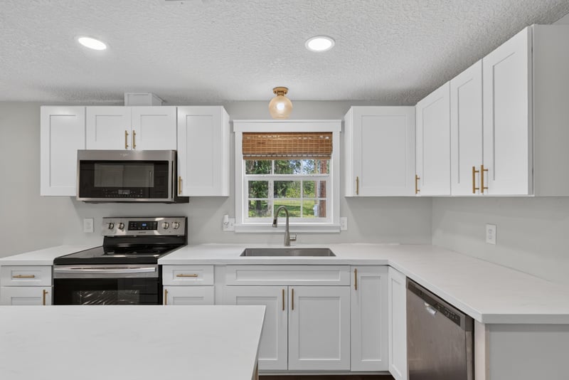 Kitchen cabinets and window above the sink at 4890 McAllister Rd, Middleburg, FL 32068