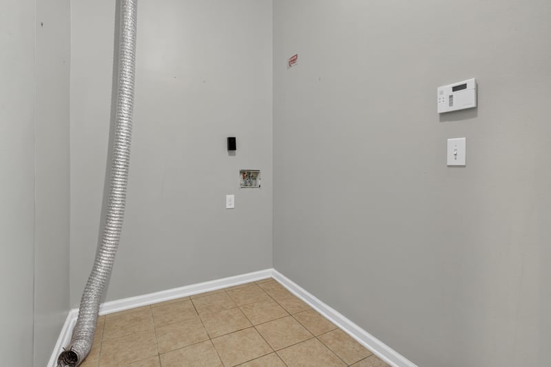 Utility area with tile flooring and hookup at 8196 Cabin Lake Cir, Jacksonville, FL 32256