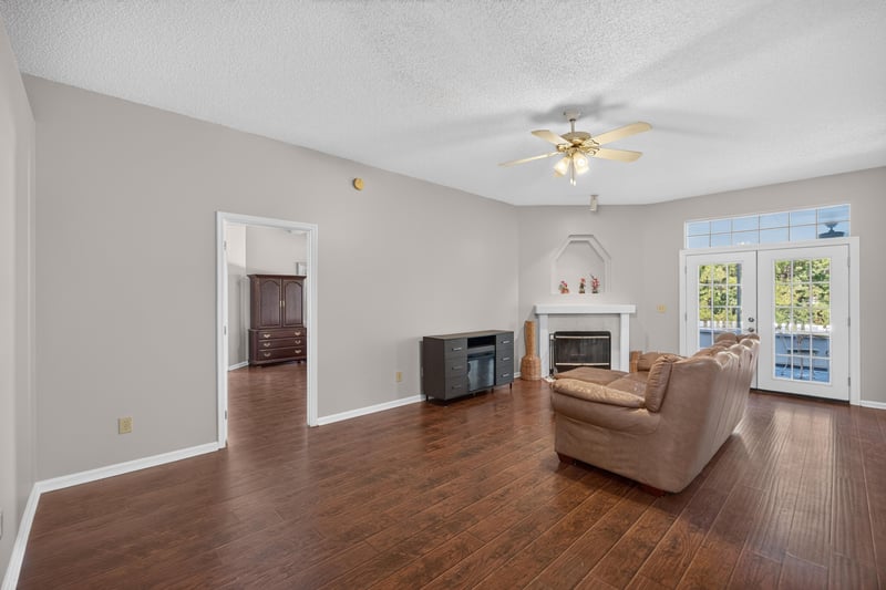 Living room with fireplace and wet bar at 11828 Heather Grove Ln, Jacksonville, FL
