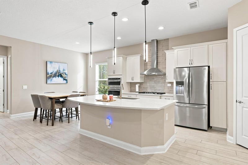 Kitchen with stainless range hood and bar seating at 27 Holly Rdg Wy, St. Augustine, FL
