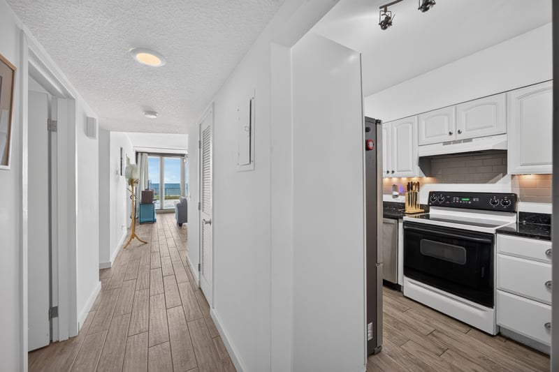 Interior hallway leading to kitchen at 601 1st St S, Jacksonville Beach