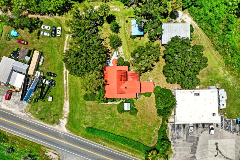 Aerial view of the home's roofline and outbuildings at 1173 US-17, Satsuma, FL 32189