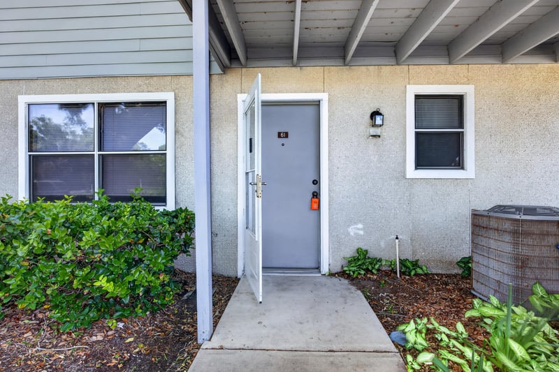 Front door entry with landscaping at 700 W Pope Rd unit h61, St. Augustine, FL 32080
