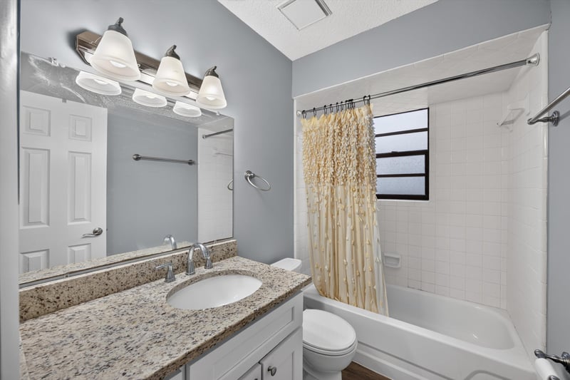 Bathroom with shower curtain and window at 12344 Cormorant Ct, Jacksonville, FL