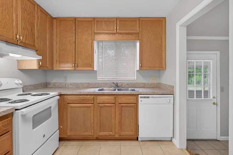 Kitchen with range and sink, oak cabinets at 2618 Arlex Dr E, Jacksonville, FL