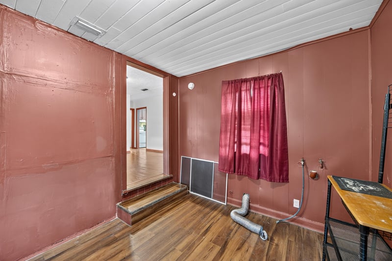 Utility room with pink curtain and hallway view at 2132 Allandale Cir W, Jacksonville, FL