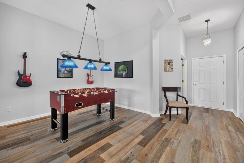 Game room with foosball table and entry door at 2065 Creekmont Dr